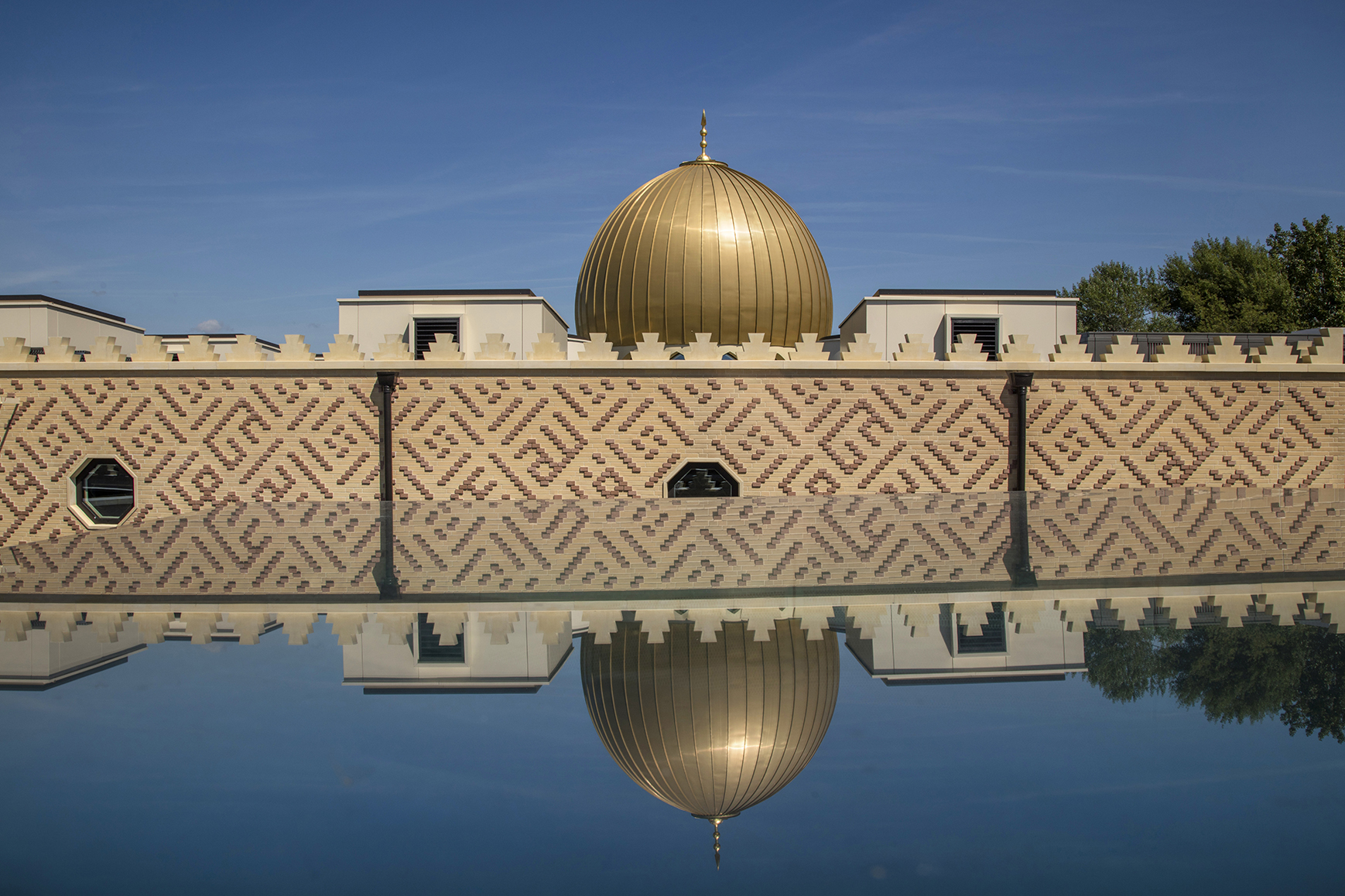 Cambridge mosque - Brick tile cladding crenulations dome reflected in rooflight