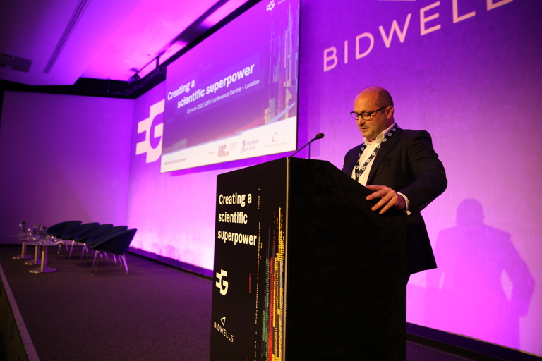 Bidwells' head of science and technology Max Bryan welcoming guests to the conference.JPG